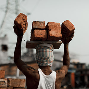 Man carrying bricks
